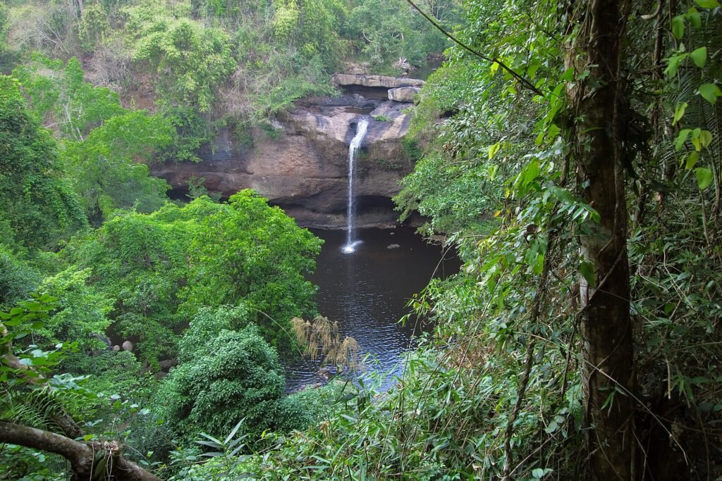 Haew Suwat Waterfall dropping into a pool surrounded by green forest in Khao Yai